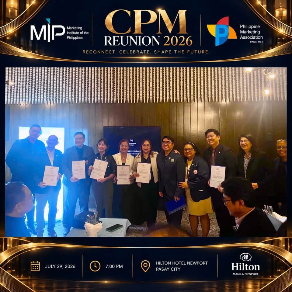 Reunion participants pose together holding certificates during the CPM Reunion 2026 program.