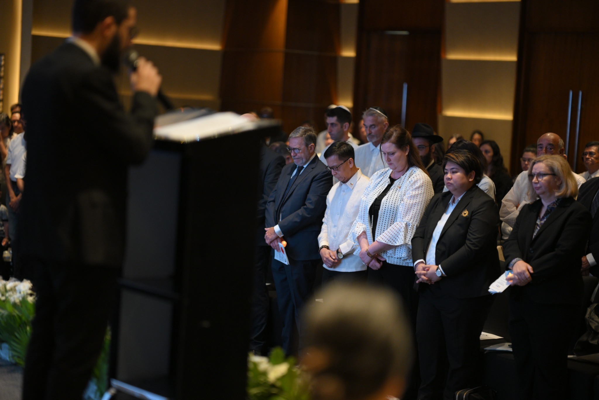 (L-R) DMW Secretary Hans Leo Cacdac, Ambassador Dana Kursh, and OWWA Administrator Patricia Yvonne Caunan during the commemoration.