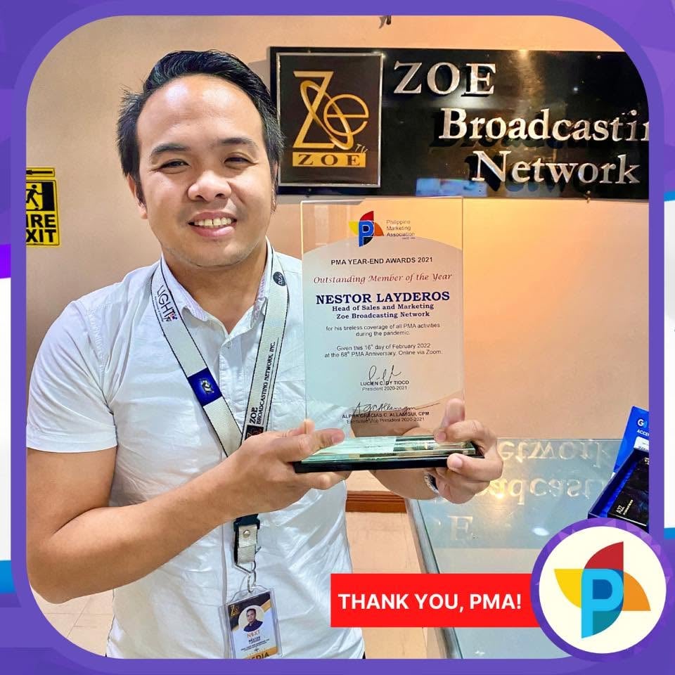 Nestor “Sir Next” Layderos with his PMA Outstanding Member of the Year trophy at ZOE Broadcasting Network.